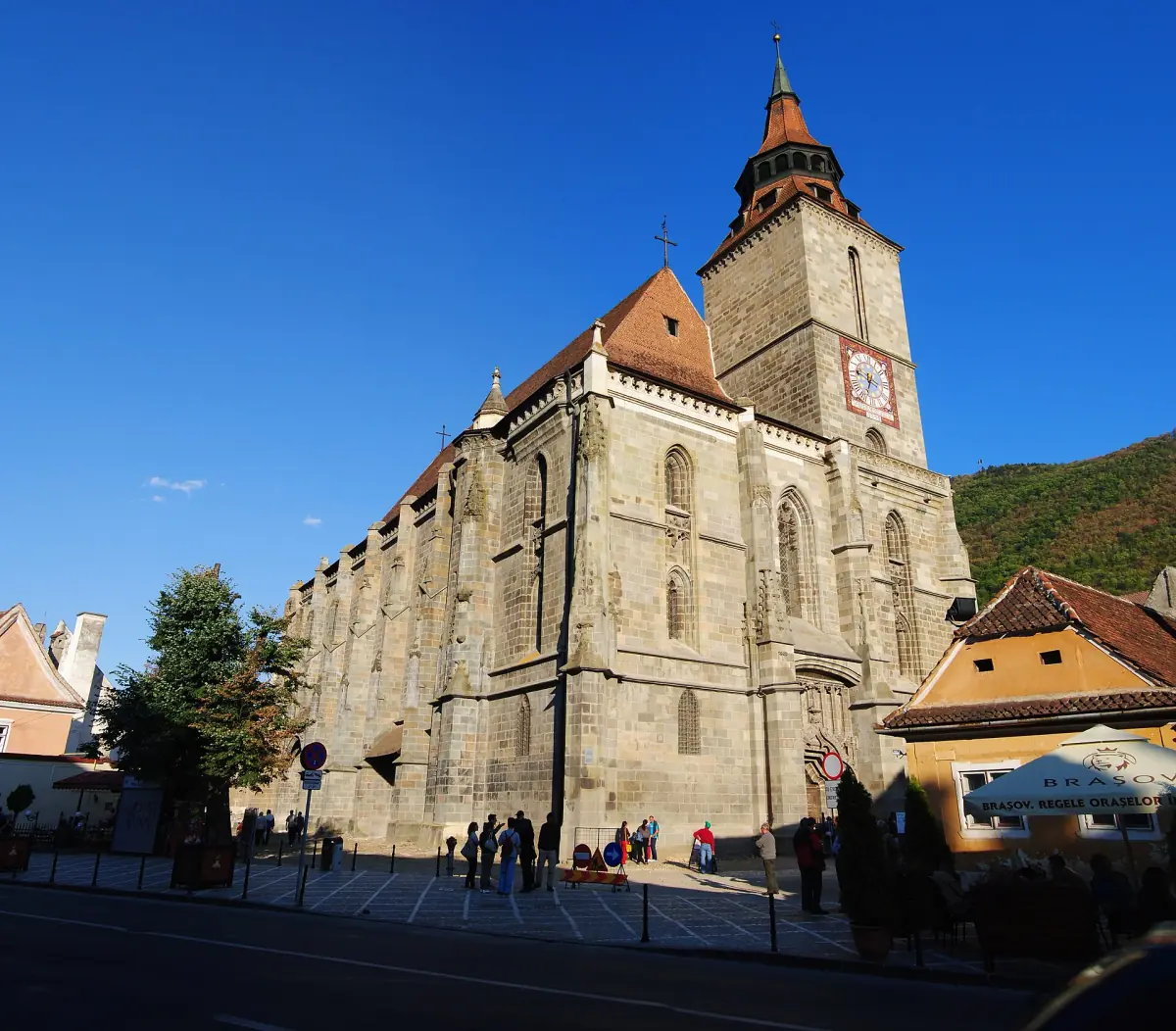 Gothic Black Church of Brașov with its tall tower under a blue sky